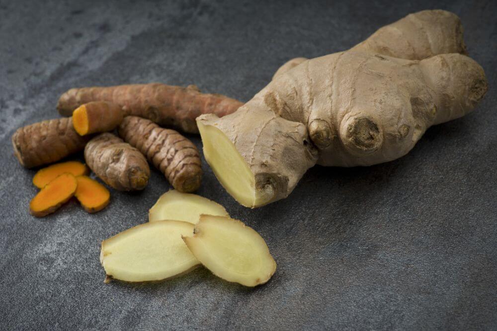 Fresh ginger root and turmeric with sliced pieces