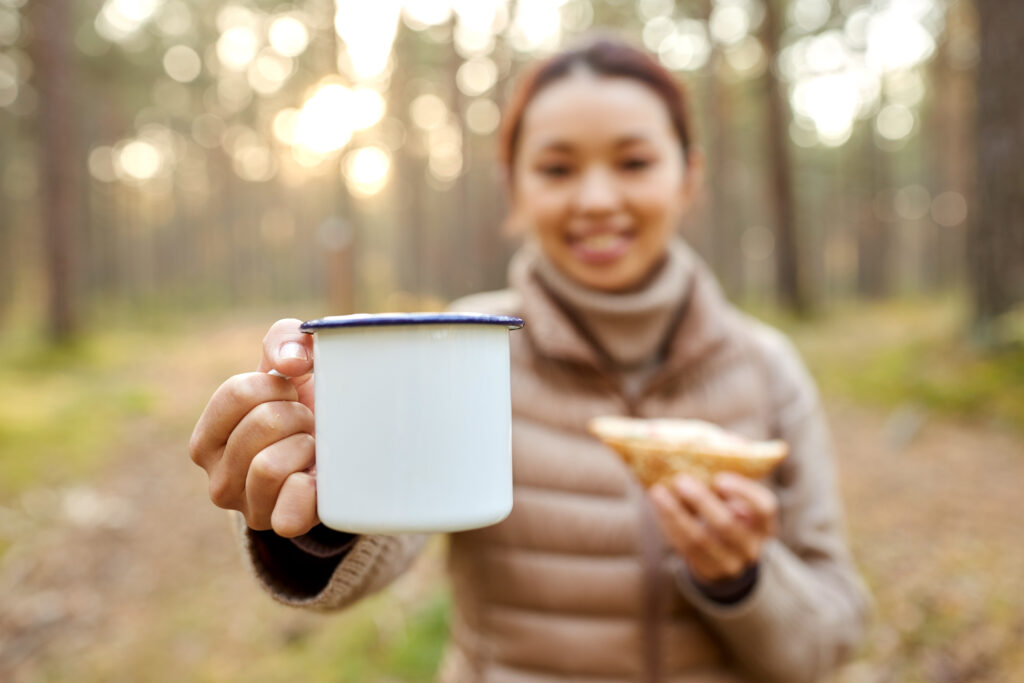 Woman drinking cup of mushroom coffee