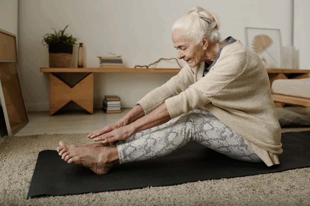 Women doing stretching at her home on the mat